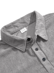 Detail of the corduroy collar and button placket on a gray long-sleeved polo shirt