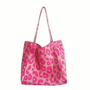 Stylish large capacity canvas tote bag featuring vibrant pink leopard animal print