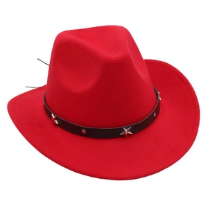 Detail of red cowboy hat with black leather band and silver star metal studs