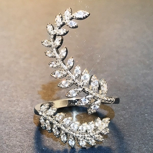 Silver plated leaf ring with sparkling zircons in a wrap around creative plant design