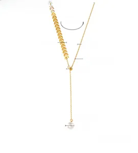 Detail showing 18k gold plated wheat leaf design with a 1cm pearl pendant on a Y-necklace