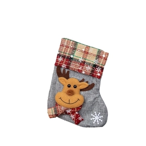 Grey Christmas stocking with reindeer design and red-green plaid cuff for holiday decor