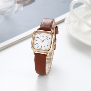 Vintage square ladies watch with rose gold case, brown leather strap, and white dial