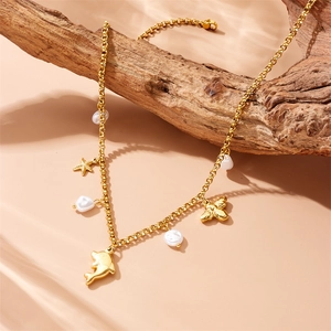 Golden stainless steel ocean theme necklace with dolphin, starfish and shell pendants