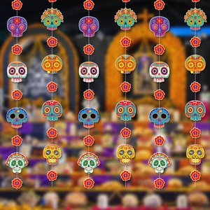 Detail of colorful Day of the Dead hanging ornaments with skull and flower patterns