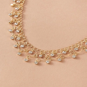 Gold layered teardrop necklace with sparkling zircon and round hollow pendants