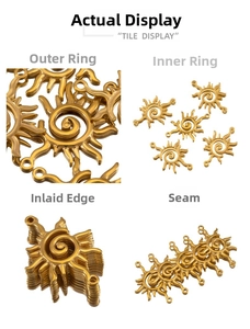 Detailed macro view of golden stainless steel sun charm with spiral center and rays