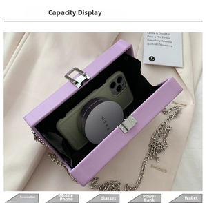 Internal view of purple leather chain bag showing capacity for phone and cosmetics