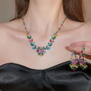 Colorful zircon leaf and heart jewelry set worn by a model with a radiant crystal finish