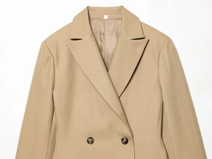 Detail of khaki twill blazer fabric texture with dark resin buttons and clean stitching