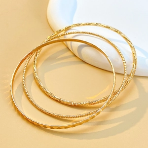 Three-piece gold hammered texture bangle set for women with minimalist stacked design