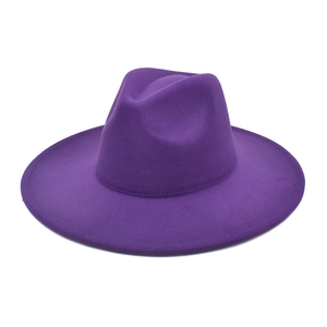 Detail of a deep purple wide brim wool felt fedora hat with a classic creased crown