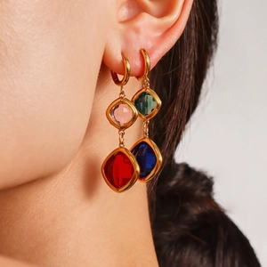 Colorful Czech glass earrings in 18k gold plated stainless steel worn by a model