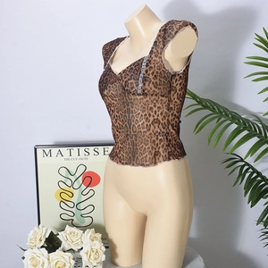Detail of leopard print mesh top showing sheer fabric and delicate ruffled hem edges