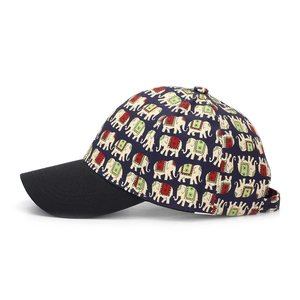 Detail of baseball cap featuring colorful ethnic elephant prints and black brim contrast