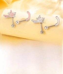 Detail of titanium cat ear studs featuring pink and white oil drip craft and 6mm posts