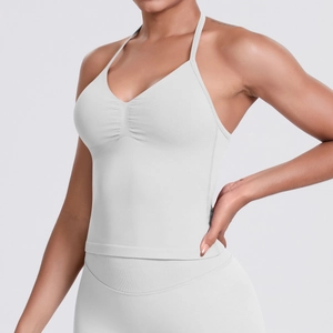 Close-up of seamless light gray sports top with ruched chest detail and thin straps