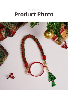 Detail of red and green woven cup handle strap with Christmas tree charm and metal clip
