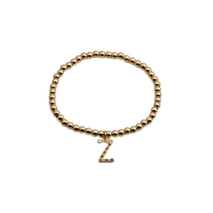 Gold beaded bracelet with sparkling colorful zircon letter Z pendant on white background