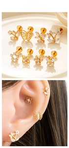 Detail set of 8 gold titanium labrets with butterfly and flower crystal motifs