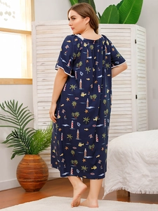 Close-up of the back of a dark blue plus-size nightgown featuring nautical prints and lace trim