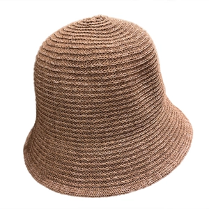 Women's lightweight breathable knitted brown bucket hat with a woven sun shade design