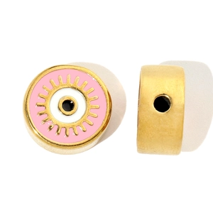 Macro detail of gold stainless steel Evil Eye beads with pink enamel and side hole