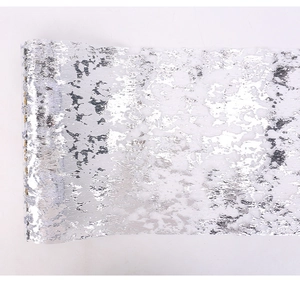 Close-up of silver decorative mesh roll with sparkling foil texture for party table decor