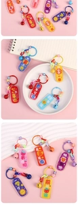 Detail of colorful acrylic keychains with motivational text and vibrant plastic chains