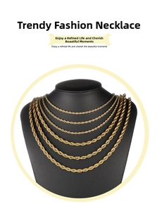 Layered gold rope chain necklaces in six different lengths shown on a black neck bust