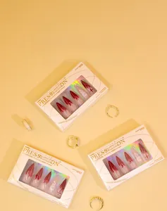 Detail of dragon pattern press-on nails in laser gold foil gift packaging boxes