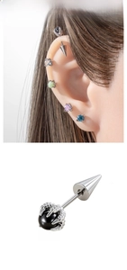 Close-up of 5mm silver dragon claw stud earring with a black bead in punk style