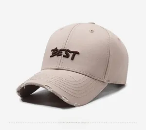 Detail of 3D BEST embroidery and distressed brim on vintage khaki baseball cap