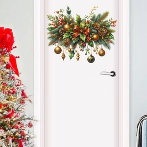 Christmas wall decal with pine wreath and golden baubles on a white interior door