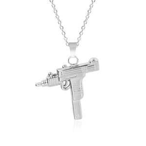Macro shot of silver Uzi submachine gun pendant and link chain in stainless steel
