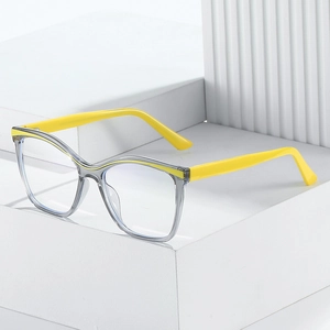 Detail of square transparent grey TR90 frame glasses with vibrant yellow temples