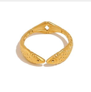 Detailed view of a gold-tone koi fish wrap ring with intricate scale textures