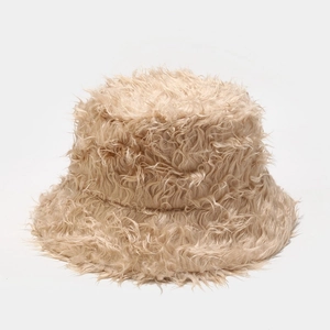 Close-up showing the thick plush texture and soft cream faux fur of this winter bucket hat