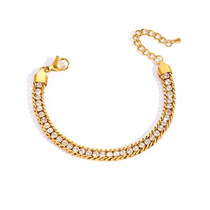 Macro detail of gold-plated tennis bracelet with sparkling zircons and lobster clasp