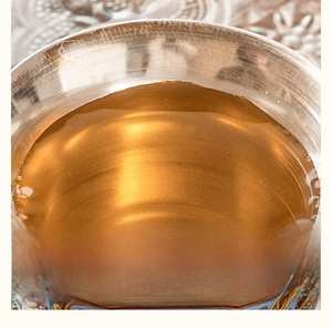Macro shot of silver-plated inner tea cup wall with exquisite hand-painted pattern