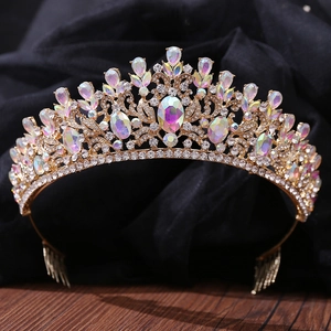 Detailed macro of Baroque bridal tiara featuring AB crystals and champagne gold engraving