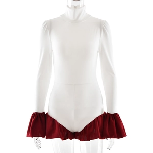 Detail of white high neck bodysuit featuring red ruffled trim accents on a clear mannequin
