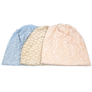 Three solid color slouchy beanies for women in light blue, beige, and soft pink orange