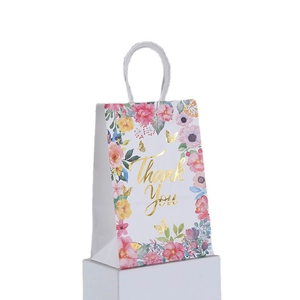 Floral kraft paper gift bag with gold foil Thank You print and white rope handles