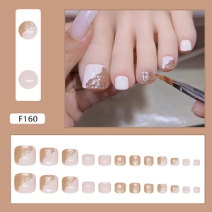 Glitter press-on toenails with white and champagne gold wave design in model F160