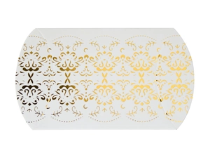 Macro detail of white pillow candy box with symmetrical golden foil vintage patterns