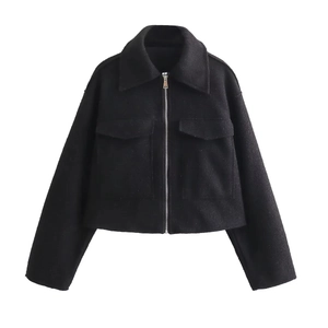 Close-up of black wool jacket featuring wide collar, large pockets and silver zipper