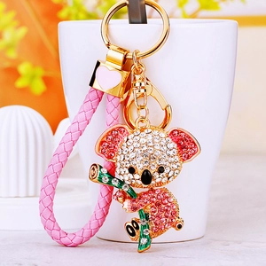 Glitzernder Koala Schlüsselanhänger mit rosa Lederband und goldenem Herz auf weißem Hintergrund