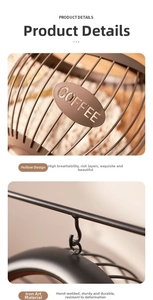 Detail of handcrafted iron hollow coffee pod holder with decorative metal COFFEE badge