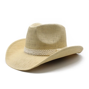 Close-up of woven straw texture and white lace band on light beige western cowboy sun hat